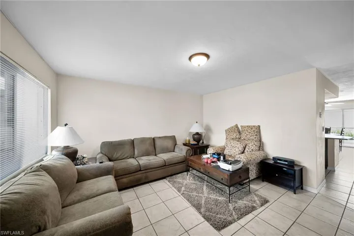 Living room featuring a healthy amount of sunlight and light tile patterned flooring