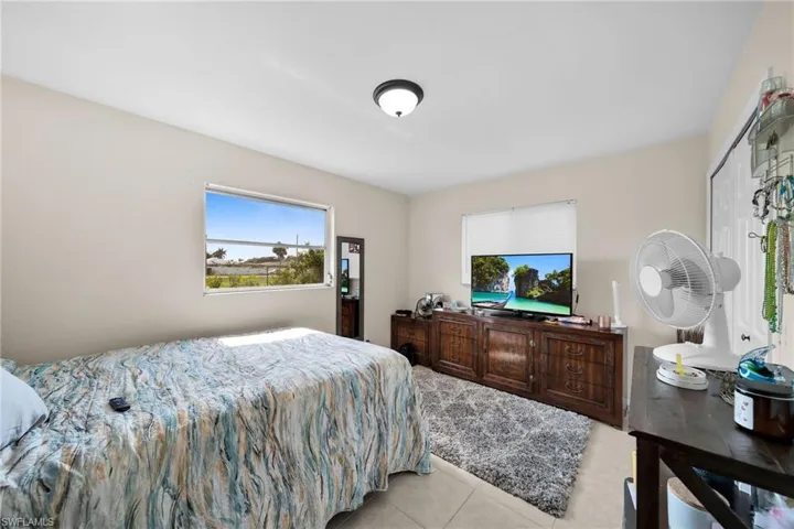 Bedroom with light tile patterned floors
