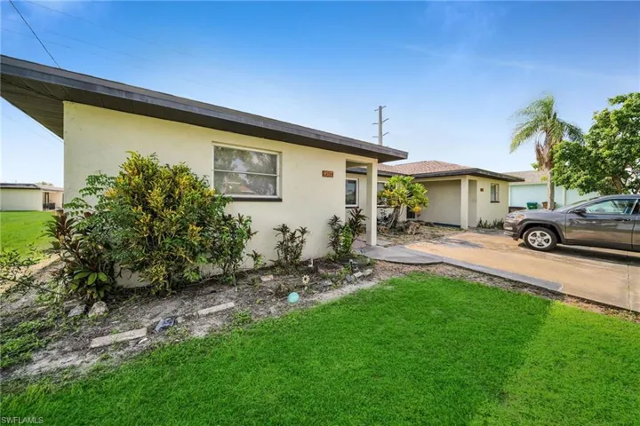 Ranch-style home with a front lawn