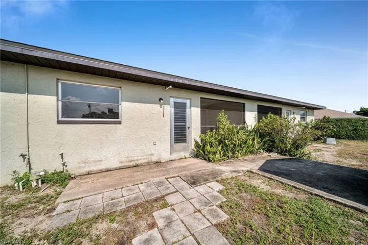 Rear view of house with a patio area