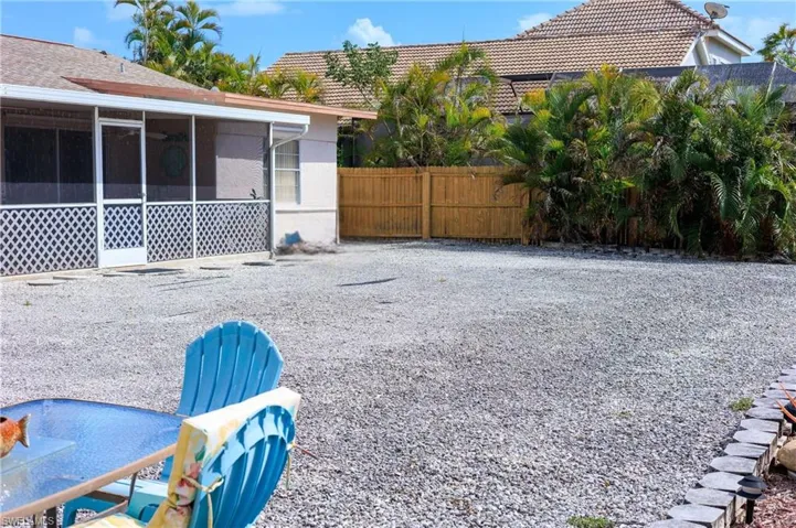 View of yard featuring a sunroom