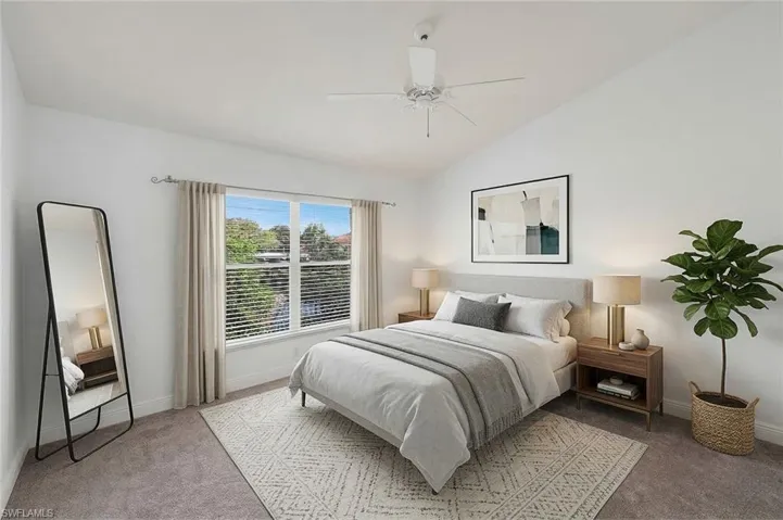 Virtually staged master bedroom suite.