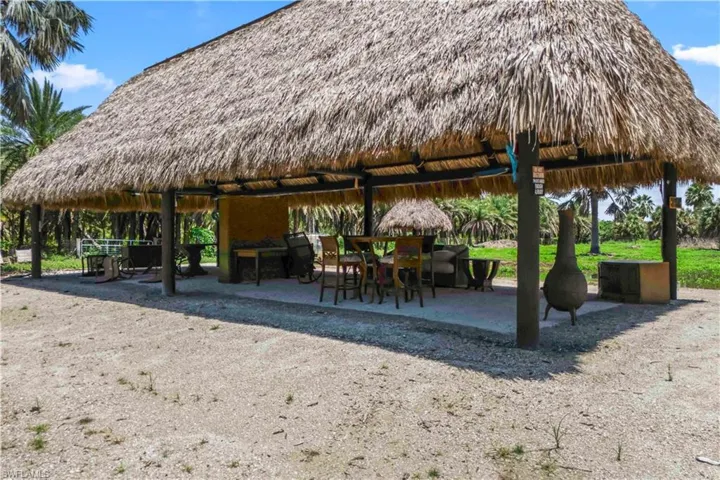 Enjoy Florida living with a spacious tiki hut and covered entertainment area.