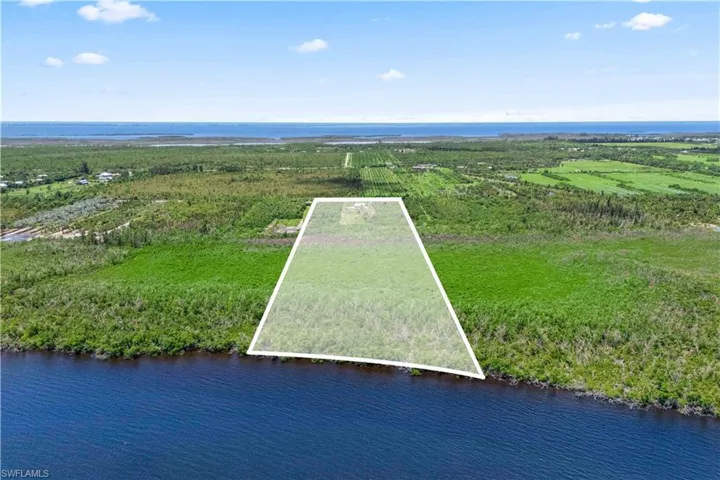 Prime Pine Island acreage meets blue skies—make this one-of-a-kind property yours.