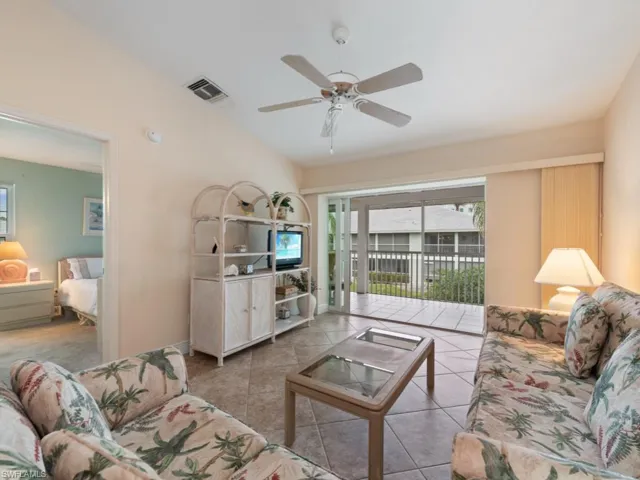 Tiled living room with ceiling fan