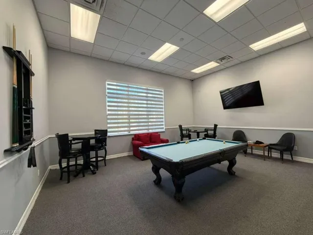 Rec room with a drop ceiling and pool table