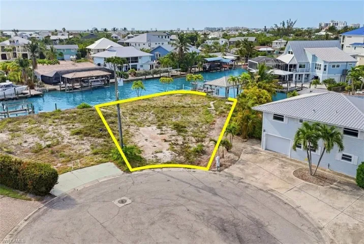 Vacant waterfront lot with direct canal access - Virtually Edited Image