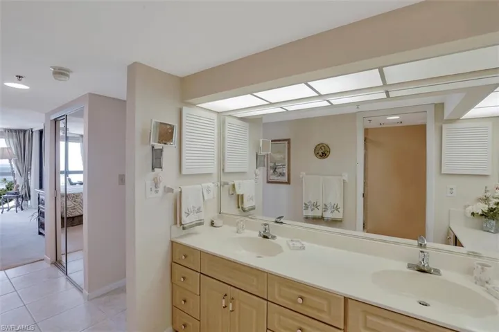 Bathroom with tile patterned flooring and vanity