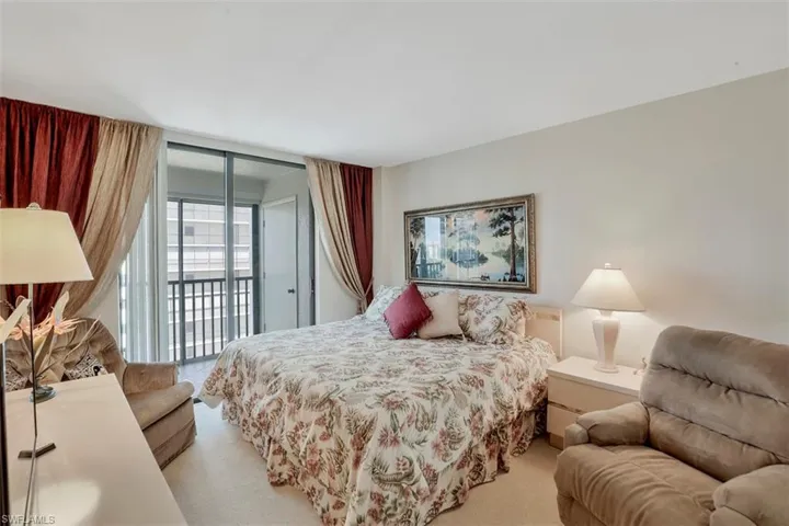 Carpeted bedroom with access to exterior