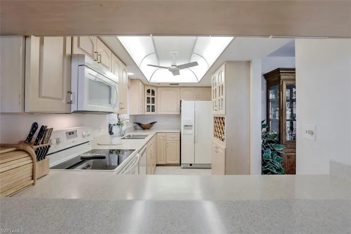 Kitchen featuring sink and white appliances