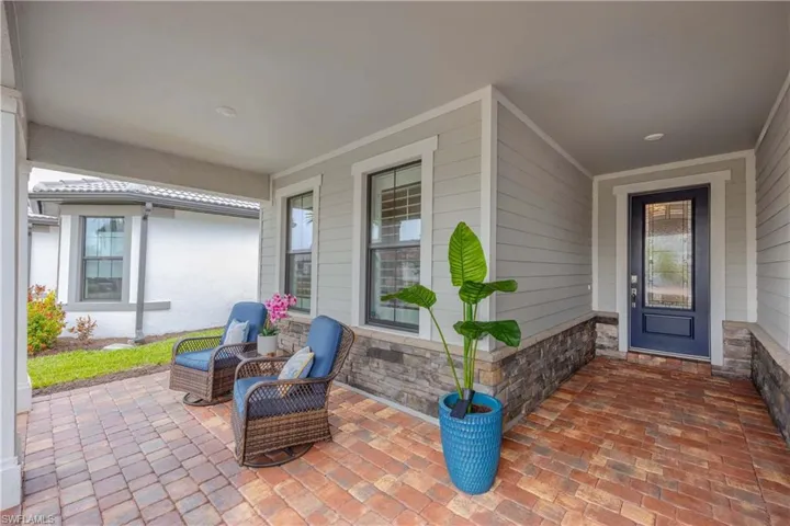 Inviting front porch to relax and enjoy a beverage and book
