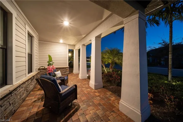 Inviting front porch to enjoy evening colors of the sky