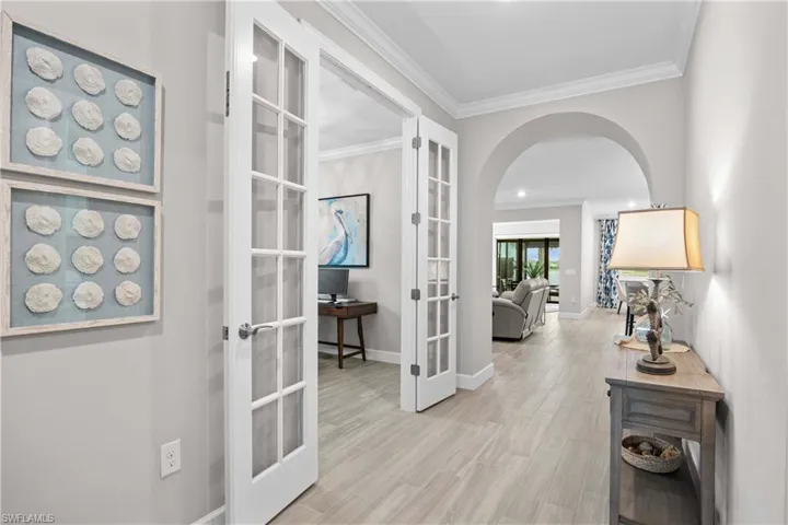 Interior entry tile style flooring, French doors to den/office and crown molding