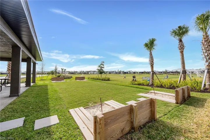 View of grassy yard with a patio