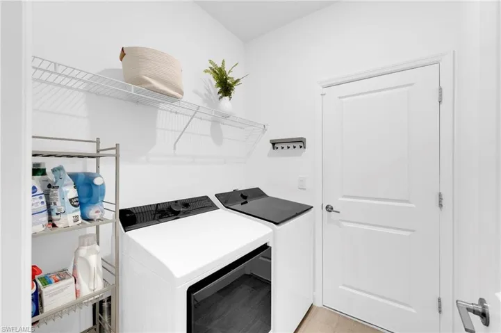 Laundry room with washing machine and dryer