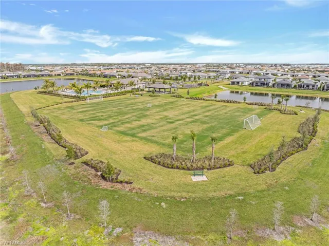 Aerial overview of property's location featuring nearby suburban area and a nearby body of water