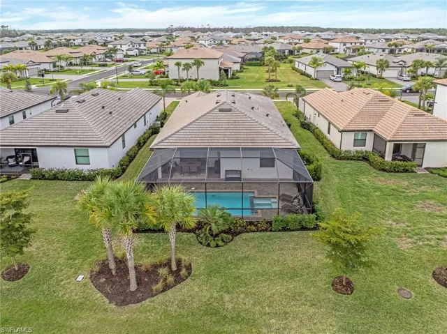 Aerial perspective of suburban area with a pool