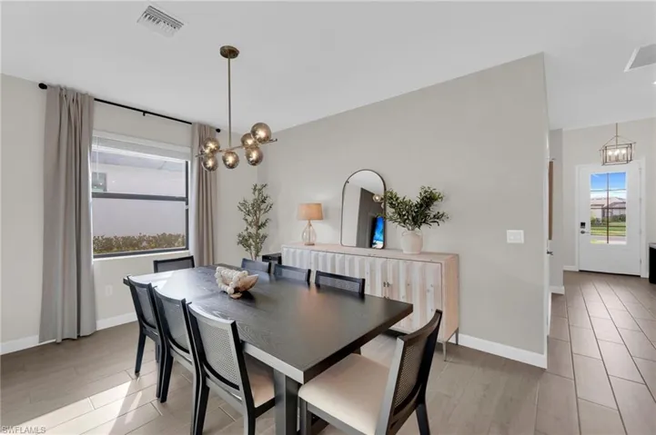 Dining room with a chandelier and light wood-style floors
