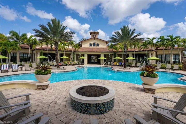 View of swimming pool featuring a fire pit and a patio area