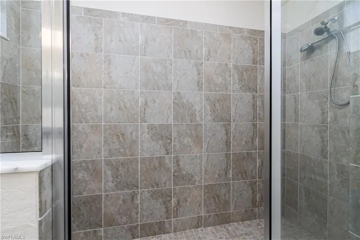 Bathroom featuring a shower with shower door