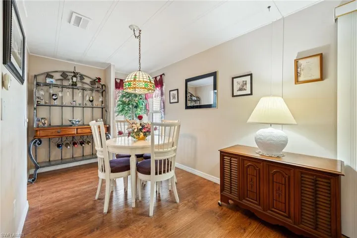 Dining area with wood finished floors and baseboards