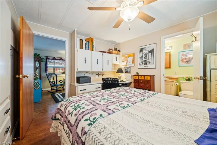 Bedroom featuring dark wood-style flooring and a ceiling fan