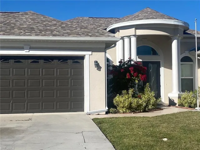 Property entrance featuring a garage