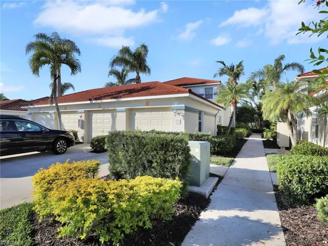View of side of property with a garage