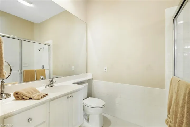 Bathroom vanity with an integrated sink and chrome faucet