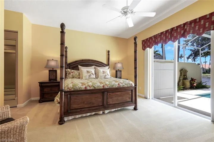 Spacious interior with neutral carpeting and warm yellow wall tones