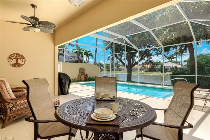 Screened patio with a built-in pool and water frontage