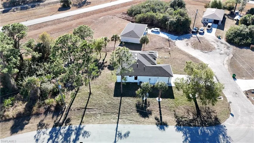Aerial overview of property's location featuring nearby suburban area