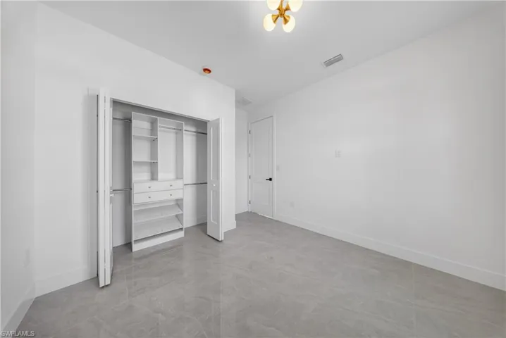 Spare room featuring baseboards