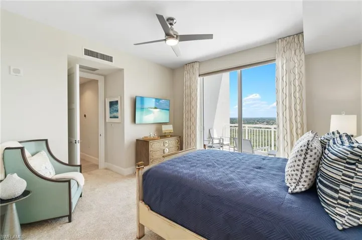 Bedroom featuring access to outside, carpet floors, ceiling fan, and baseboards