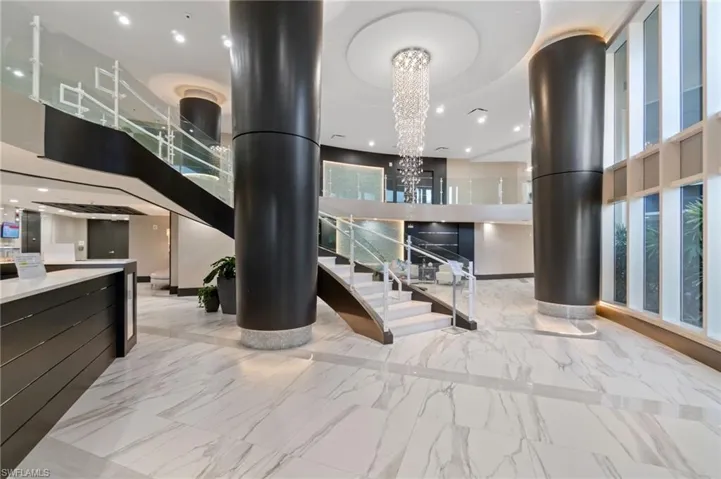 Lobby with recessed lighting and a towering ceiling