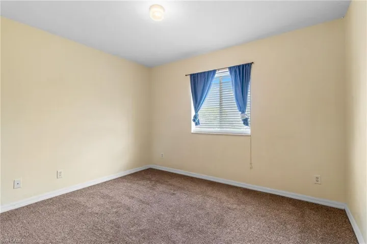 Unfurnished room with carpet flooring