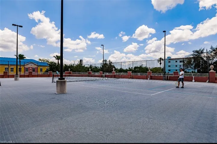 View of tennis court with community pickleball court