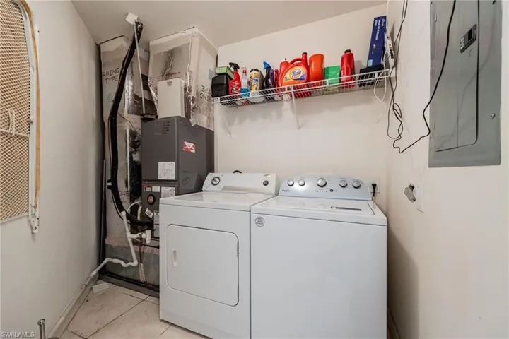 Laundry area with full washer and dryer