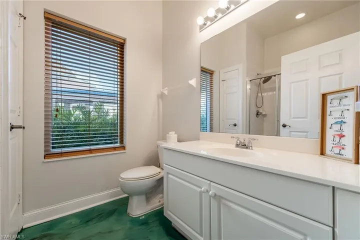 Full bathroom with vanity and a stall shower