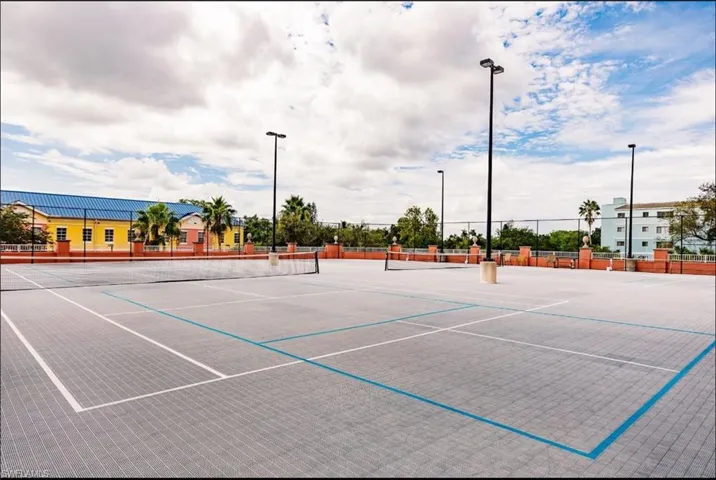 View of tennis court with community pickleball court