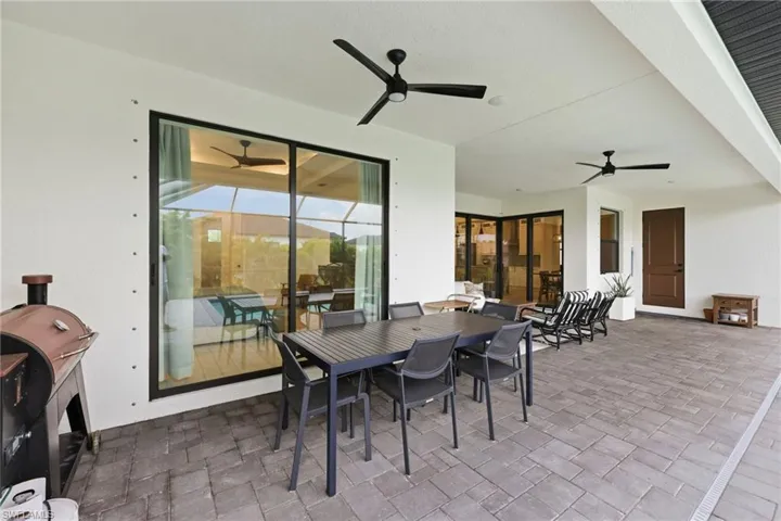 View of patio / terrace featuring outdoor dining space and ceiling fan