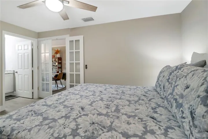 Bedroom featuring light hardwood / wood-style floors and ceiling fan