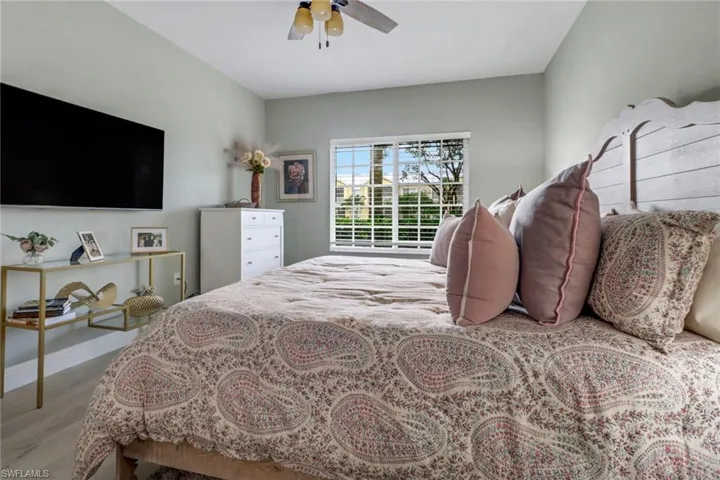 Bedroom featuring light hardwood / wood-style flooring and ceiling fan