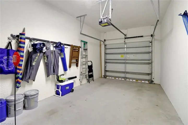 Garage featuring a garage door opener