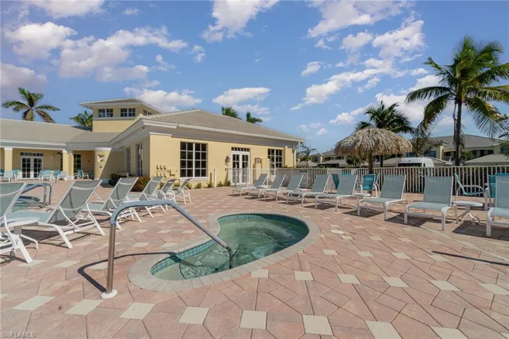 View of swimming pool with french doors and a patio