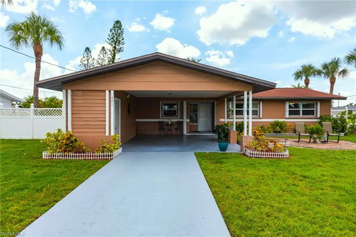 View of front of house featuring concrete driveway