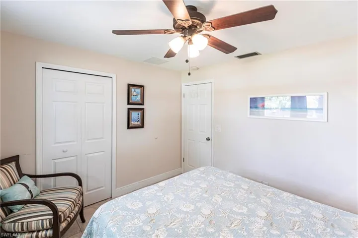 Bedroom featuring a closet and a ceiling fan