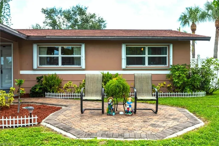 View of front facade and a patio area
