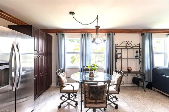 Dining space featuring healthy amount of natural light and light tile patterned floors