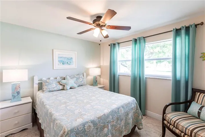 Bedroom featuring a ceiling fan and light tile patterned floors